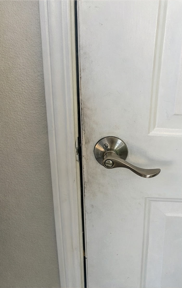 White door and trim before detail cleaning